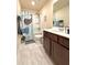 Bathroom with a tub-shower combo, stylish vanity, and eye-catching whale-themed shower curtain at 3836 Saddle Hill Way, Douglasville, GA 30135