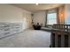 Bright bedroom featuring a large window, a gray dresser, and a play area with comfortable floor cushions at 3836 Saddle Hill Way, Douglasville, GA 30135