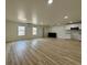 Open floor plan living room featuring light wood flooring and recessed lighting, with modern AC unit at 3836 Saddle Hill Way, Douglasville, GA 30135