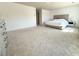 Spacious main bedroom with carpet flooring, a decorative dresser, and natural light from the windows at 3836 Saddle Hill Way, Douglasville, GA 30135