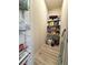 Well-organized walk-in pantry with ample shelving for storage and organization at 3836 Saddle Hill Way, Douglasville, GA 30135