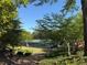 Scenic view of tennis courts nestled among lush greenery, offering a serene recreational space at 3836 Saddle Hill Way, Douglasville, GA 30135