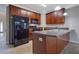 Galley kitchen with stainless steel appliances and a breakfast bar at 5027 Lower Elm St, Atlanta, GA 30349