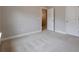 Bedroom features neutral walls, plush carpet, and a pair of large closets at 5414 Splendida Ct, Fairburn, GA 30213