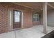 Inviting home entrance featuring a stylish front door with sidelights and a cozy covered porch at 5414 Splendida Ct, Fairburn, GA 30213