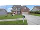 Two-story home featuring a brick and siding exterior with well-manicured lawn and inviting curb appeal at 5414 Splendida Ct, Fairburn, GA 30213