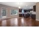 Eat-in kitchen features dark cabinets, granite countertops, and stainless steel appliances at 5414 Splendida Ct, Fairburn, GA 30213