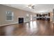 Open floorplan showcases living room with a fireplace and access to the kitchen at 5414 Splendida Ct, Fairburn, GA 30213