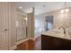Main bathroom featuring a walk-in shower, a soaking tub, and a double vanity at 5414 Splendida Ct, Fairburn, GA 30213
