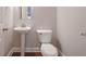 Powder room with hardwood floor and pedestal sink at 5414 Splendida Ct, Fairburn, GA 30213