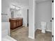 Bathroom with double vanity and a toilet room, offering a private space for personal hygiene at 5456 Union Hill Ct, Union City, GA 30291