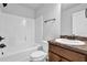 Bathroom featuring a combined tub and shower with tiled walls and a vanity with a granite countertop at 5456 Union Hill Ct, Union City, GA 30291