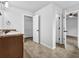 Bathroom featuring a vanity with brown countertops, tile floors, and an open doorway to the closet at 5456 Union Hill Ct, Union City, GA 30291