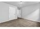 Clean bedroom with plush carpeting, neutral walls, and interior doors at 5456 Union Hill Ct, Union City, GA 30291