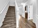 Bright entryway with hardwood floors and a carpeted staircase at 5456 Union Hill Ct, Union City, GA 30291