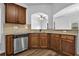 Modern kitchen featuring stainless steel appliances, granite countertops, and wood cabinets at 5456 Union Hill Ct, Union City, GA 30291