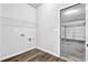 Laundry room with laminate flooring and a view into the garage at 5456 Union Hill Ct, Union City, GA 30291
