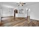 Open-concept living room featuring hardwood floors, archways, and natural light at 5456 Union Hill Ct, Union City, GA 30291