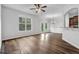 Spacious living room with hardwood floors, white trim, and large windows at 5456 Union Hill Ct, Union City, GA 30291