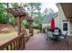 Wooden deck with outdoor seating, a pergola swing, and a grill at 772 Vinings Estates Se Dr, Mableton, GA 30126