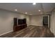 Finished basement with wood-look flooring, recessed lighting, and entertainment center at 772 Vinings Estates Se Dr, Mableton, GA 30126