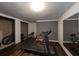 Finished basement with workout equipment and wood-look flooring at 772 Vinings Estates Se Dr, Mableton, GA 30126