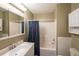 Bathroom with a vanity, a large mirror, and a shower with a blue curtain at 772 Vinings Estates Se Dr, Mableton, GA 30126