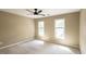 Spacious bedroom featuring natural light, neutral walls and plush carpeting at 772 Vinings Estates Se Dr, Mableton, GA 30126