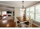 Bright breakfast nook with natural light and a view to the living room featuring a fireplace and access to the rear patio at 772 Vinings Estates Se Dr, Mableton, GA 30126