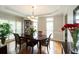 Elegant dining room with hardwood floors, stylish chandelier, and seating for six at 772 Vinings Estates Se Dr, Mableton, GA 30126