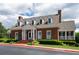 Stately brick building with a symmetrical design, classic columns, and well-maintained landscaping at 772 Vinings Estates Se Dr, Mableton, GA 30126