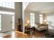 Welcoming foyer with hardwood floors, a front door, and lots of natural light at 772 Vinings Estates Se Dr, Mableton, GA 30126