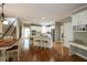 Light-filled home interior showcasing hardwood floors, stairs, open floor plan, and stylish finishes at 772 Vinings Estates Se Dr, Mableton, GA 30126