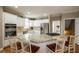 Spacious kitchen featuring stainless steel appliances, granite countertops, a gas cooktop, and an eat-in island at 772 Vinings Estates Se Dr, Mableton, GA 30126