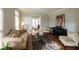 Inviting living room with hardwood floors, a piano, and comfortable seating at 772 Vinings Estates Se Dr, Mableton, GA 30126