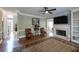 Inviting living room with hardwood floors, neutral walls, a fireplace, and an open doorway to the foyer at 772 Vinings Estates Se Dr, Mableton, GA 30126