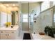 Well-lit bathroom with glass-enclosed shower and vanity sink at 772 Vinings Estates Se Dr, Mableton, GA 30126