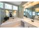 A spacious main bathroom, with natural light, double vanity and large glass enclosed shower at 772 Vinings Estates Se Dr, Mableton, GA 30126