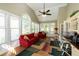 Inviting sunroom featuring hardwood floors, a vaulted ceiling, and lots of natural light at 772 Vinings Estates Se Dr, Mableton, GA 30126