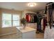 Walk-in closet with lots of storage and natural light from the window at 772 Vinings Estates Se Dr, Mableton, GA 30126