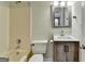 Bathroom with shower/tub combo and decorative vanity with cabinet storage at 1335 Jamestowne Trl, Alpharetta, GA 30009