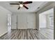 Bedroom with ceiling fan with doorway to another room and closet with doors at 1335 Jamestowne Trl, Alpharetta, GA 30009
