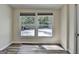 Bright bedroom features updated flooring, neutral paint, and natural light from the updated window at 1335 Jamestowne Trl, Alpharetta, GA 30009