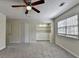 A large bedroom with carpet, closet, bonus nook, and natural light from updated window at 1335 Jamestowne Trl, Alpharetta, GA 30009