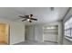 A spacious bedroom with a carpet, ceiling fan, double closet and a bonus nook at 1335 Jamestowne Trl, Alpharetta, GA 30009