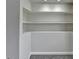 Bonus nook with wood-look flooring, white walls, and built-in shelving at 1335 Jamestowne Trl, Alpharetta, GA 30009