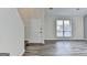 Bright foyer area featuring hardwood flooring and an entrance door to the right at 1335 Jamestowne Trl, Alpharetta, GA 30009