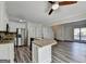 Kitchen with stainless steel refrigerator and adjacent breakfast nook with seating at the kitchen island at 1335 Jamestowne Trl, Alpharetta, GA 30009