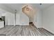 Bright living space with wood-look floors, a staircase, and access to kitchen and closets at 1335 Jamestowne Trl, Alpharetta, GA 30009