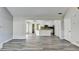 Bright and airy living room that seamlessly flows into the adjacent kitchen area and a side door at 1335 Jamestowne Trl, Alpharetta, GA 30009